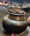 Large cooking pots over open fire